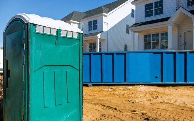 portable toilet and dumpster at a construction site in Noblesville IN